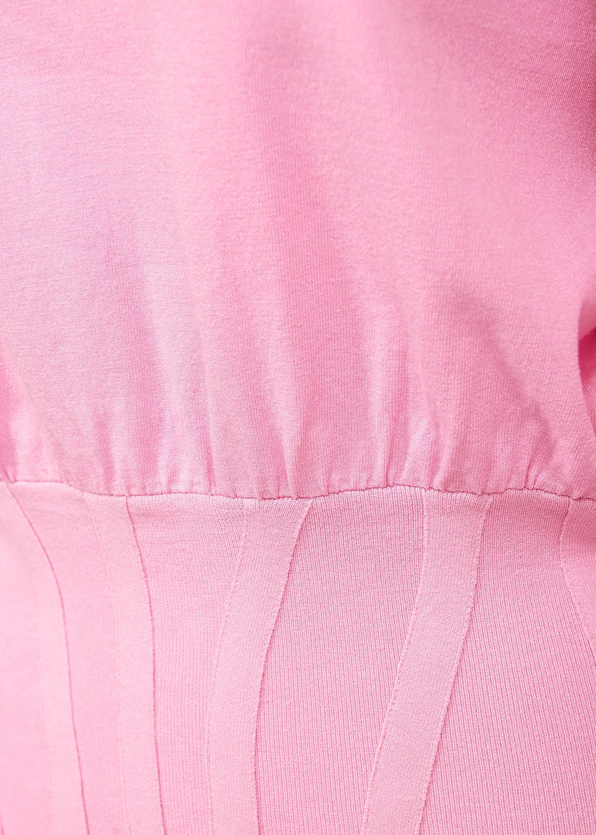 Light pink knitted sweater with fitted waist