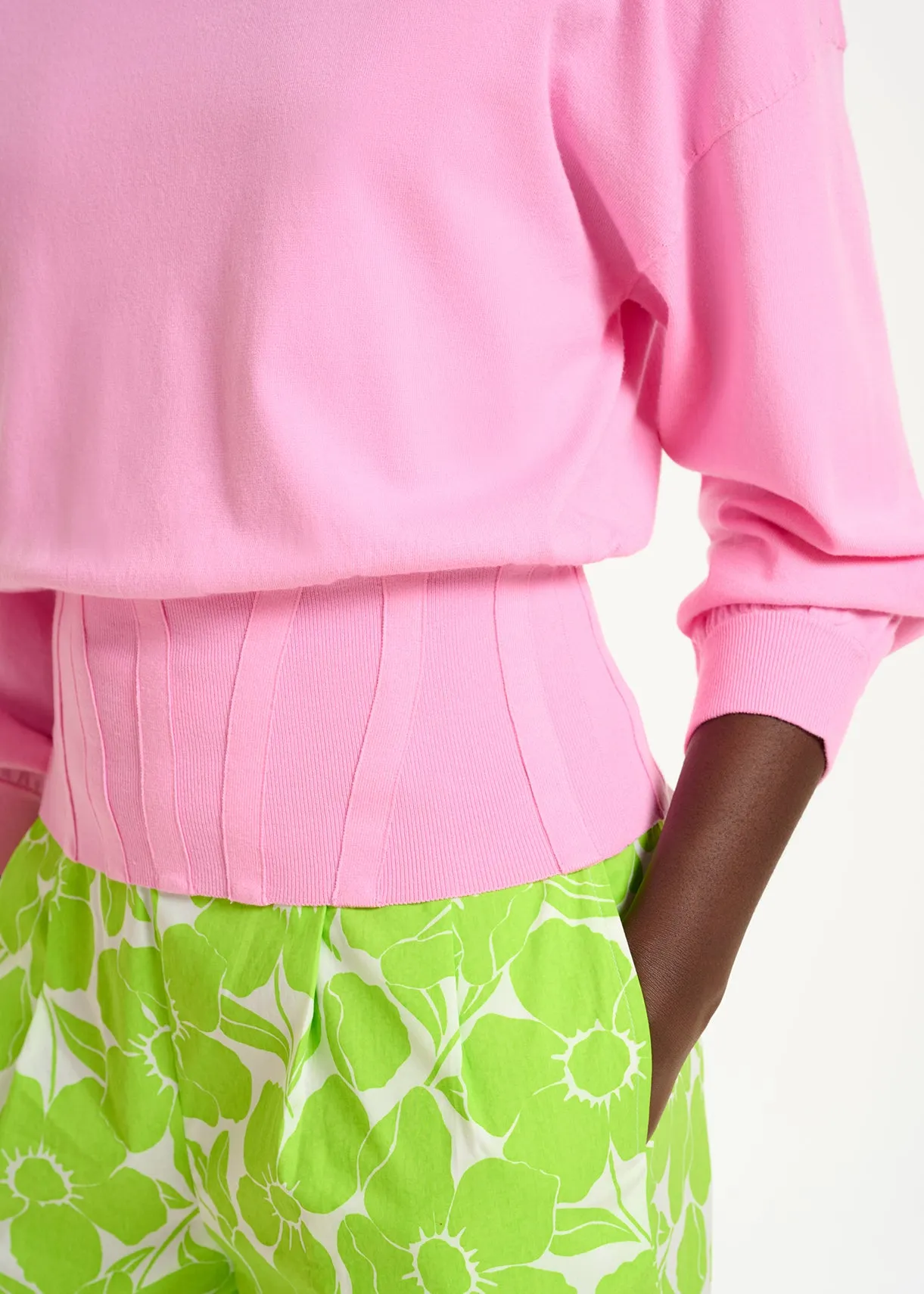 Light pink knitted sweater with fitted waist