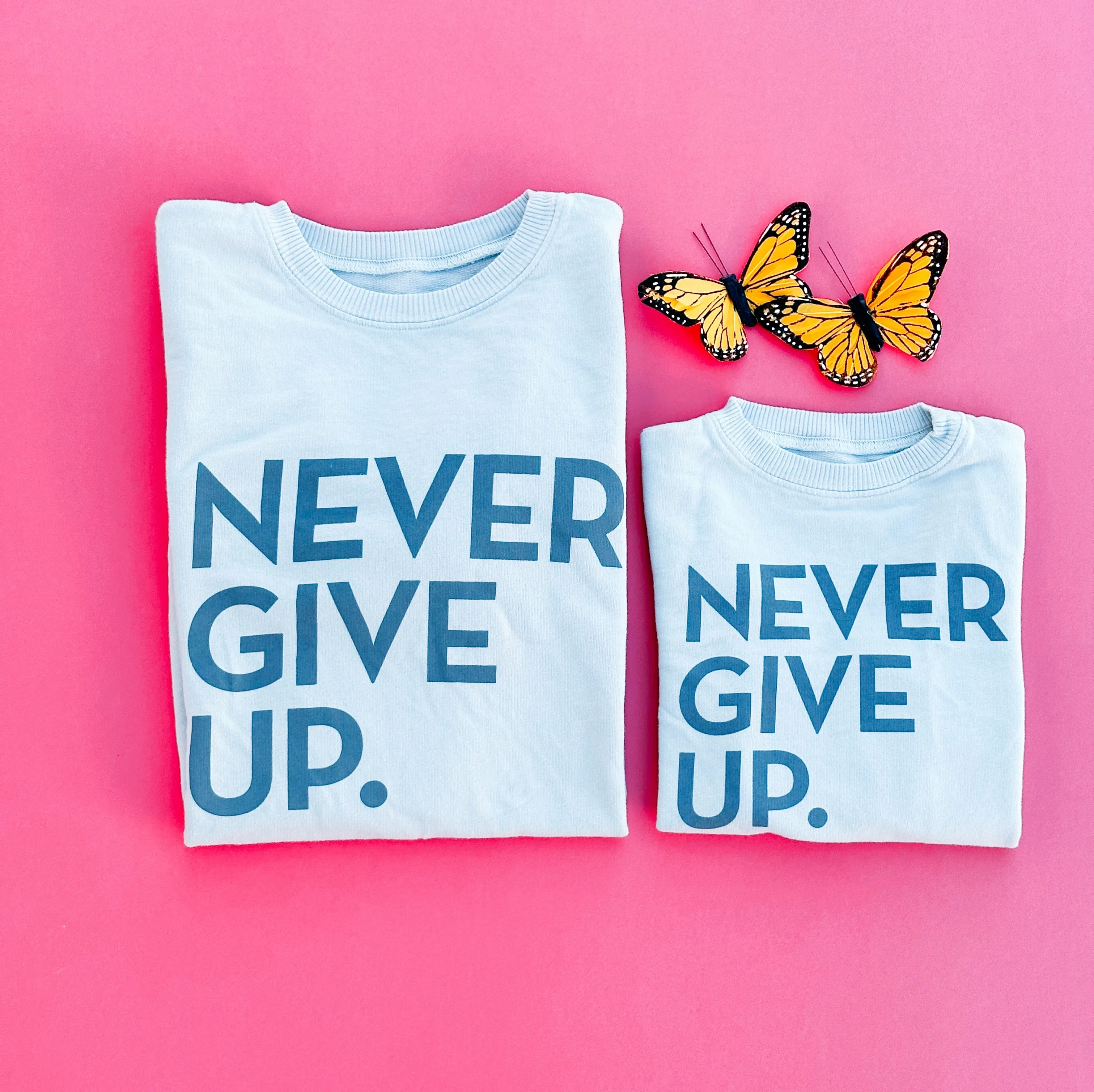 NEVER GIVE UP. GLACIER GRAY PULLOVER