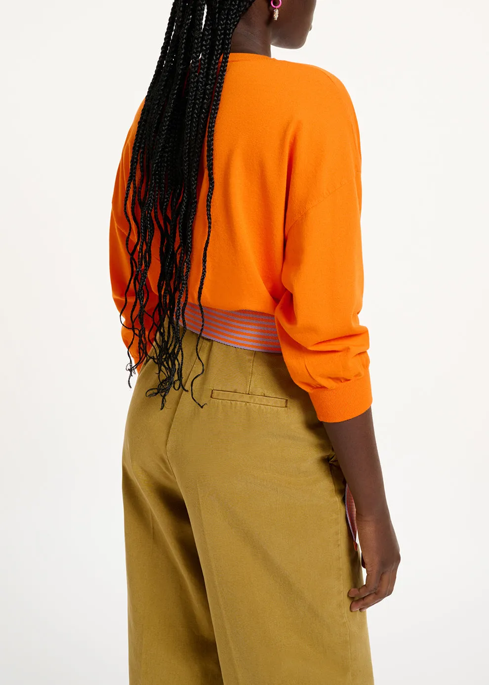 Orange knitted sweater with fitted waist