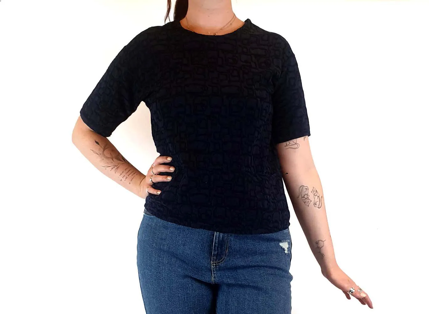 Textured navy top with cute front pockets best fits size 12