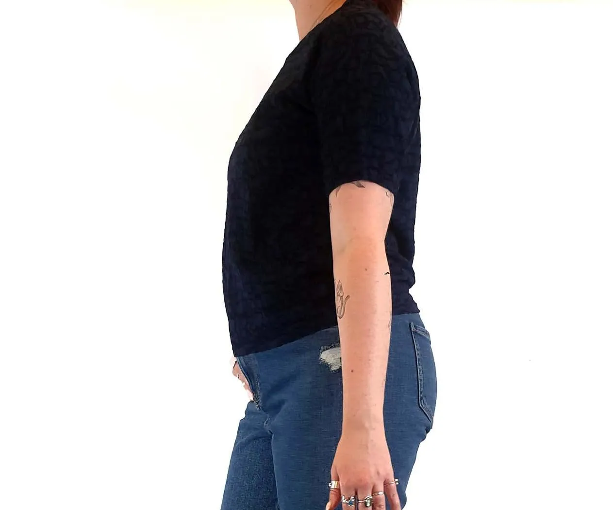 Textured navy top with cute front pockets best fits size 12